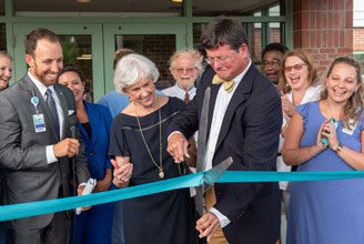 collins Collins cuts the ribbon